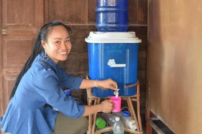 woman in laos and water filter