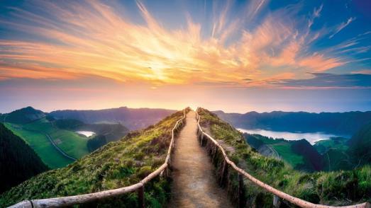 sunset behind a bridge